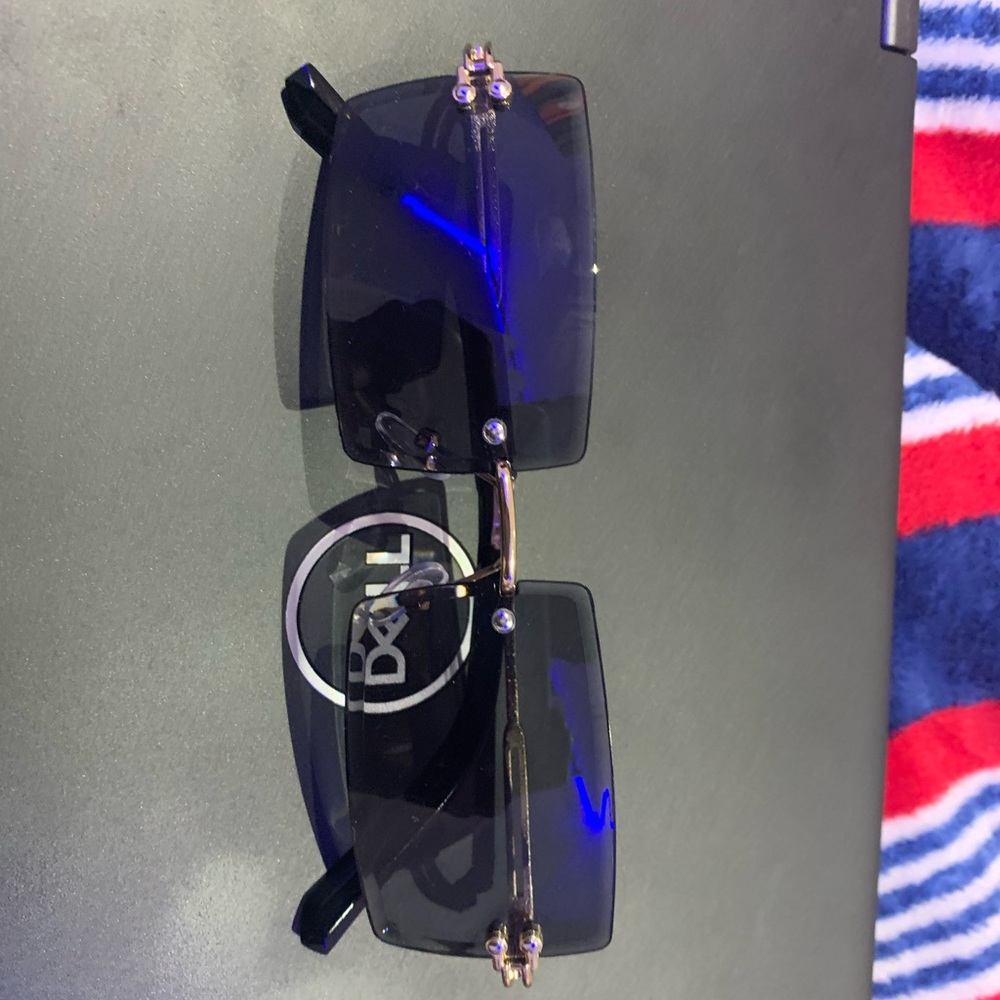 Black and gold rimless sunglasses